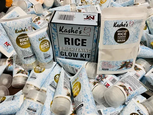 Kashe’s Rice Brightening Glow Kit surrounded by multiple brightening rice scrub, face wash, and powder organic mask tubes