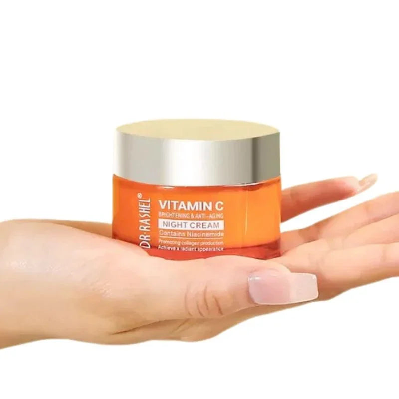 Hand holding Dr Rashel Vitamin C night cream jar with brightening and anti-aging benefits