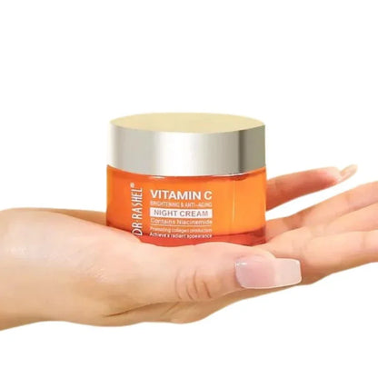 Hand holding Dr Rashel Vitamin C night cream jar with brightening and anti-aging benefits