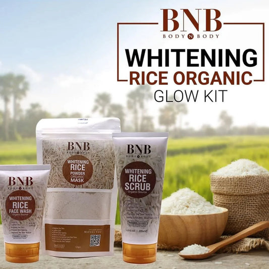BNB Whitening Rice Organic Glow Kit with face wash, powder mask, scrub, and rice bowls on wooden table